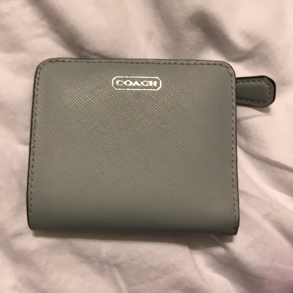 Blue coach wallet. In new condition.